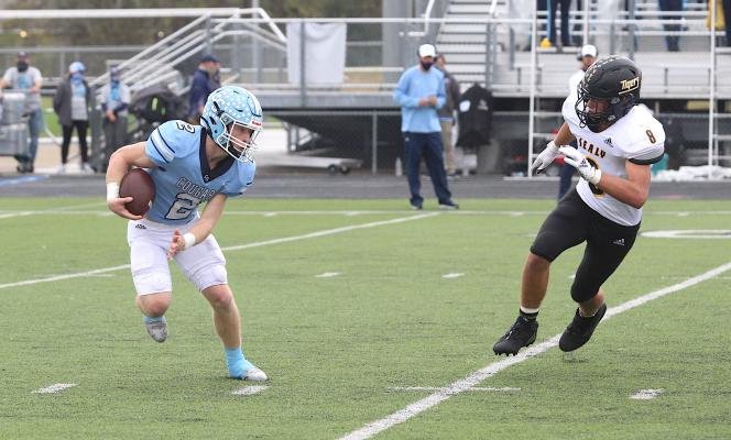 Sealy senior Clayton Prazak chases down China Spring quarterback Major Bowden in the Tigers’ regional semifinal playoff game at Cougar Stadium in College Station. Prazak was one of five Sealy players honored with all-state recognition from the Padilla Poll. (Cole McNanna/Sealy News)