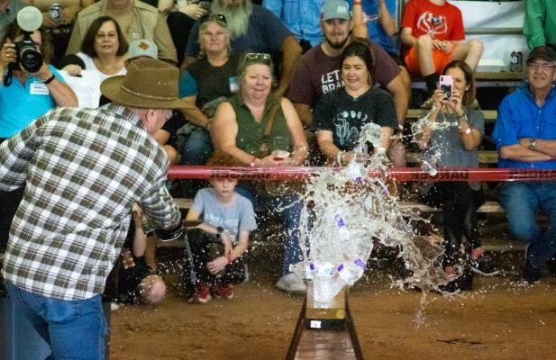 As part of the chopping competition, a line of water bottles was one of the obstacles that left some spectators in the splash zone. COLE McNANNA