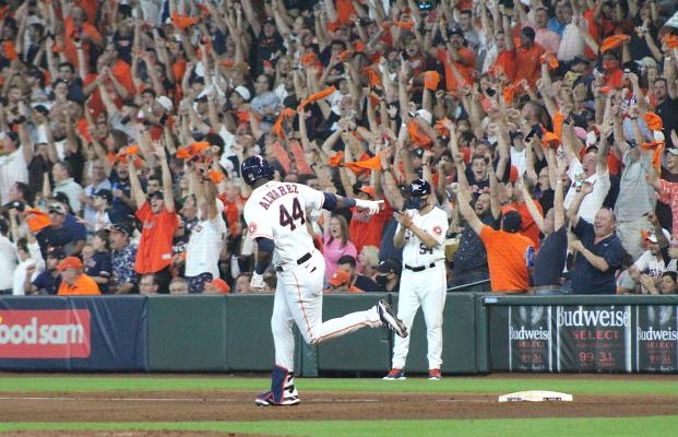 Houston designated hitter Yordan Alvarez points to the Astros bench after rounding first on his fifth-inning solo home run during Game 1 of the ALDS at Minute Maid Park in Houston Thursday afternoon. COLE McNANNA