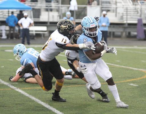 Sealy senior Tyler Hennessey reaches to make a tackle on China Spring running back Emmanuel Abdallah during the Tigers’ regional semifinal playoff game at Cougar Stadium in College Station. Hennessey earned second-team all-state honors in his final season. (Cole McNanna/Sealy News)
