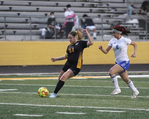 Lady Tiger junior Destinee Castillo lines up a shot during a district game against Harmony on Jan. 29 at T.J. Mills Stadium. Castillo was named the co-offensive player of the year for District 20. (Cole McNanna/Sealy News)