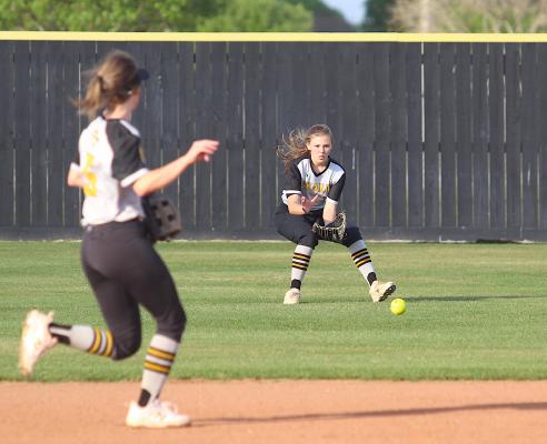 Sealy senior Brooke Kram hones in on a ground ball during the Lady Tigers’ non-district finale against Shiner at home Monday. (Cole McNanna/Sealy News)