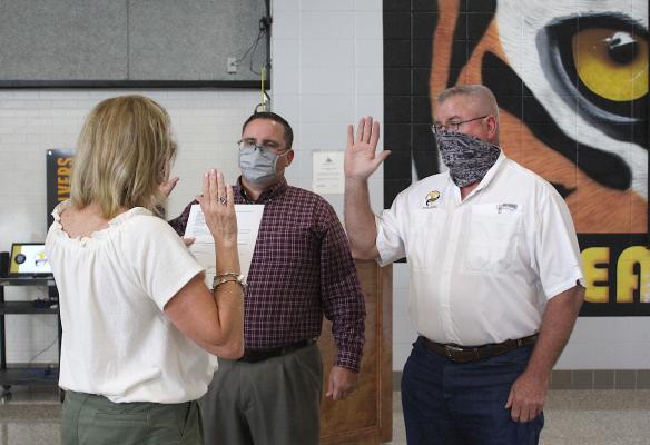 John Sodolak and Joe Mike Young are sworn into their two-year terms during the regular meeting of the Sealy ISD Board of Trustees in the Sealy Junior High School Cafeteria Wednesday, May 26. Sodolak won Place 6 and Young was re-elected to Place 7. COLE McNANNA