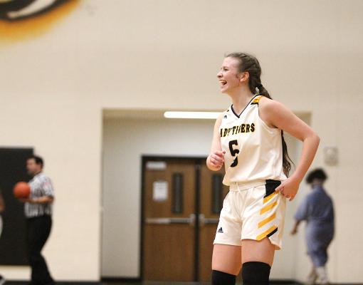 Sealy senior Brylie Bond laughs while retreating to the Lady Tigers' offensive end after taking a charge in the second half of the season finale against Navasota last Tuesday (Cole McNanna/Sealy News)
