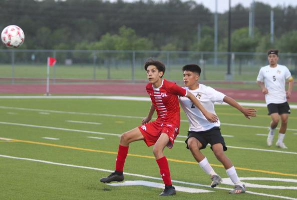 Tiger senior Xavier Olvera battles a Splendora attacker in the second half of the postseason matchup April 6, 2021, at Cy Park High School. COLE McNANNA