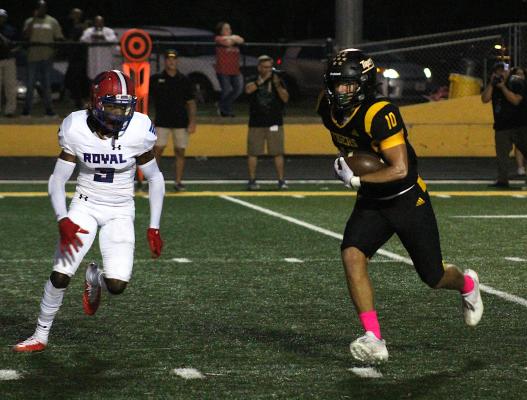 Sealy senior Thomas Clark recorded two receptions on offense in addition to his interception he returned for a touchdown to help the Tigers open district play with a 26-0 win over Royal Friday night at home. COLE McNANNA