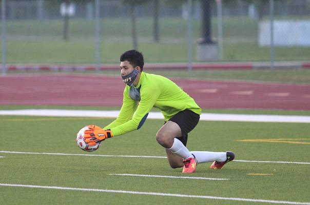 Sealy senior Brayan Aviles secures a save during the Tigers’ playoff game against Splendora April 6, 2021, at Cy Park High School. COLE McNANNA
