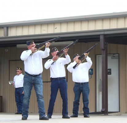 The Sealy American Legion Honor Guard performs a 21-gun salute to conclude the celebration of life event in honor of Paul Dronka Monday afternoon at the Columbus Hall. COLE McNANNA
