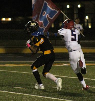 Sealy senior Graham Samonte reels in one of his four catches that totaled a team-high 75 receiving yards to help the Tigers beat Royal 26-0 to open district play Friday night at home. COLE McNANNA