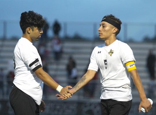 Tiger senior Fonsi Avalos (13) greets classmate Angel Guerrero (5) on the sideline after the buzzer finalized Sealy’s 3-2 loss to Splendora last Tuesday in the regional semifinals at Cy Park High School. (Cole McNanna/Sealy News)