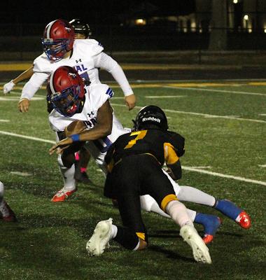 Tiger senior Graham Samonte delivers one of his three tackles that helped shut out the Royal Falcons Friday night at T.J. Mills Stadium. Samonte also caught four passes on offense for 75 receiving yards. COLE McNANNA
