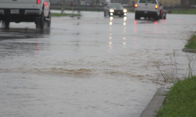 Heavy rains June 3 caused flooded roadways all over town, including Schmidt Road in Sealy. COLE McNANNA