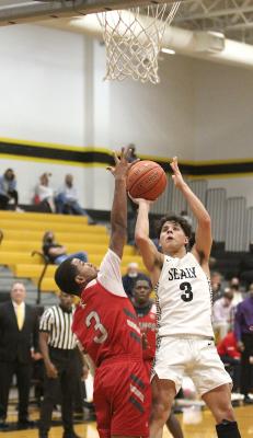 Sealy senior Nick Martinez falls away from a shot during a district contest against El Campo at home Feb. 5. Martinez eventually hit the game-winning in overtime and was recognized with second-team all-district distinction. (Cole McNanna/Sealy News)