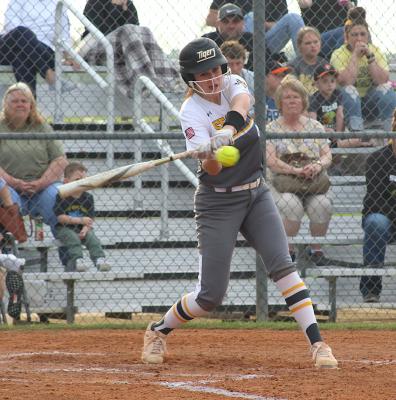 Sealy senior Avery Oliver lines up a pitch during the final regular-season home game last Friday against Navasota. Oliver provided an opposite-field, two-RBI double in the Lady Tigers’ five-run third inning. (Cole McNanna/Sealy News)