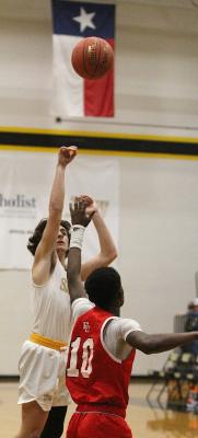 Sealy junior Ryder Ramirez lifts a floater in the first half of the Tigers’ district battle against El Campo last Friday at home. COLE MCNANNA