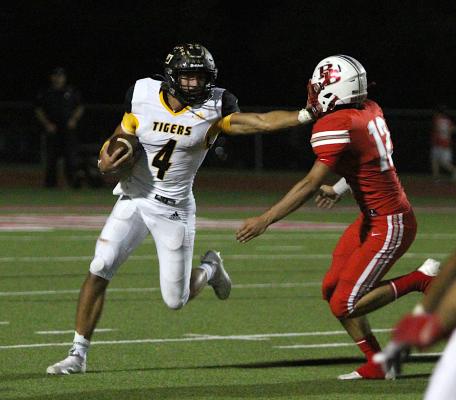 Sealy senior Connor Krenek delivers a stiff arm to Bellville’s Landon Lischka during the district contest between the Tigers and Brahmas at the Pasture of Pain Oct. 15. Krenek was named the District 12 Utility Player of the Year when all-district awards were released. PHOTOS BY COLE McNANNA