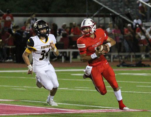 Sealy's Jeffrey Neu flushes Bellville's Reid McCann from the pocket during the rivalry game at the Pasture of Pain Oct. 15, 2021. The Tigers and Brahmas remained in the same district after the biennial realignment of the UIL. COLE McNANNA