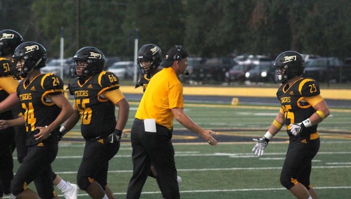 Sealy Head Football Coach Shane Mobley congratulates Richard Hahn (25) and the field goal unit after a successful point-after try in the Tigers' season-opening win over Brazosport at home Aug. 27. Sealy picked up a 40-30 win over Navasota on the road Friday night. COLE McNANNA