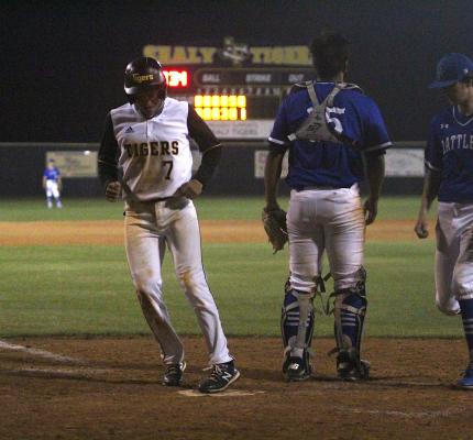 Tiger junior Jose Bludau touches home on an error to add an insurance run to Sealy’s lead in the sixth inning of a 5-0 win over Navasota last Friday at Aubrey “Mutt” Stuessel Stadium. (Cole McNanna/Sealy News)