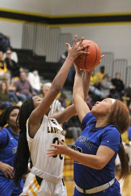Sealy junior Jasmyne Joiner secures a rebound in the fourth quarter of the Lady Tigers’ district contest against Navasota last Friday at home. COLE McNANNA