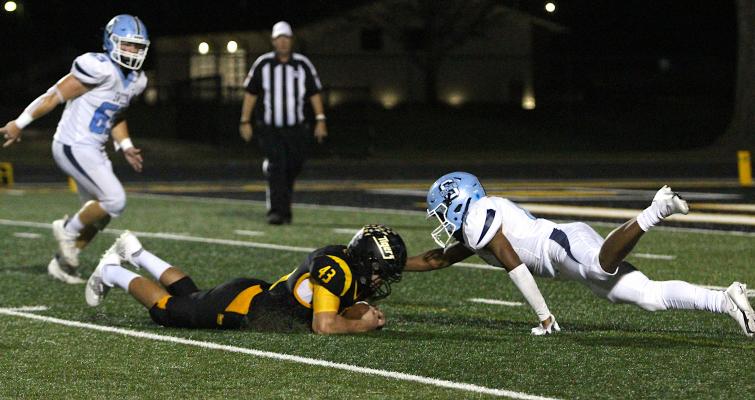 Tiger junior William Forrester hops on a loose ball following a forced fumble from senior Gage Grigar during Sealy’s district game against Sweeny Oct. 22, 2021, at home. Forrester was one of 19 named to the Padilla Poll All-State second-team defense. COLE McNANNA