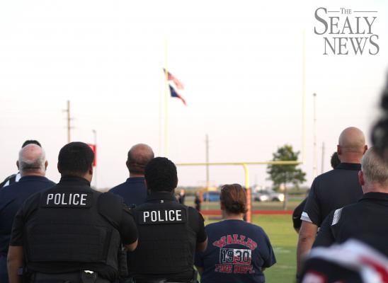 Local first responders joined Brazos Cougar football players for the national anthem ahead of last Friday’s football game against Burton in Wallis.