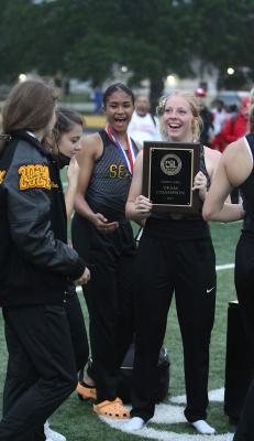 Lady Tigers Dejua Posada and Courtney Roberts celebrate the team title with their Sealy teammates after last Wednesday’s Area Championship hosted at T.J. Mills Stadium. (Cole McNanna/Sealy News)