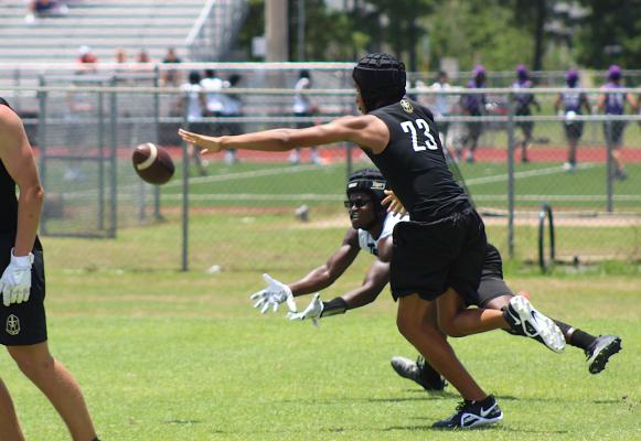 Sealy athlete A’vonte Nunn extends for a catch attempt on a pass during the Tigers’ 7-on-7 game June 23 against Jordan at Taylor High School. COLE McNANNA