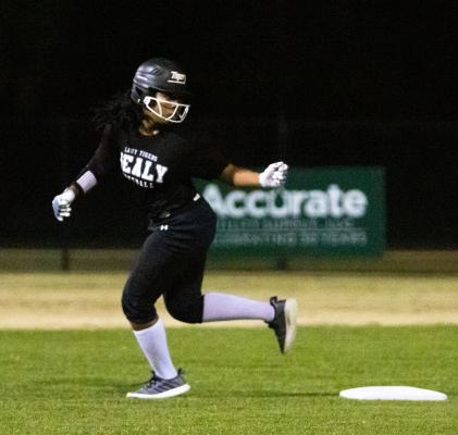 Lady Tiger sophomore Antreece Coleman rounds second and looks for the ball during Sealy’s first scrimmage of the preseason at B&PW Park last Tuesday. COLE McNANNA