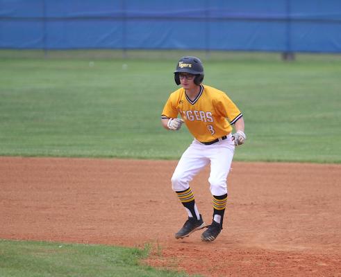 Dylan Thaxton takes a lead off first base after he drew a walk in the third inning of the Tigers’ District 24-4A matchup with Royal in Brookshire on Monday. (Cole McNanna/Sealy News)