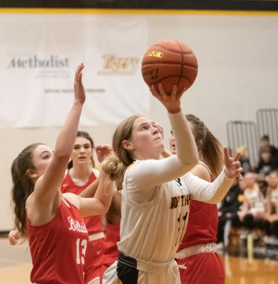 Lady Tiger senior Evelyn Harrington leans into a shot during the first quarter of Sealy’s district battle with Bellville at home last Friday. COLE McNANNA