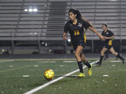 Sealy freshman Rebeca Garza advances the ball during the Lady Tigers’ district game against Harmony on Feb. 26 at T.J. Mills Stadium. Garza was named the co-freshman of the year for District 20-4A. (Cole McNanna/Sealy News)