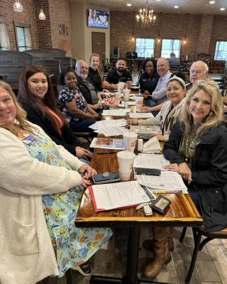 The Sealy Chamber Blue Blazers working hard for the community during their monthly meeting.