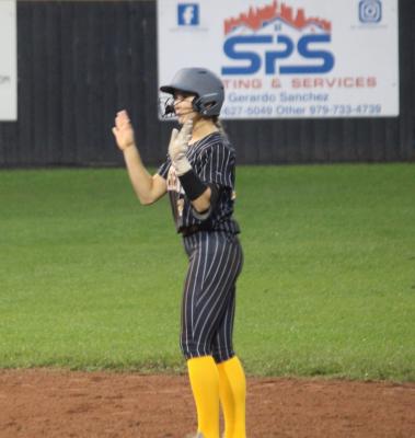 Avery Grigar celebrates hitting a double by waving to her teammates in the dugout. CITIZEN | EVAN HALE