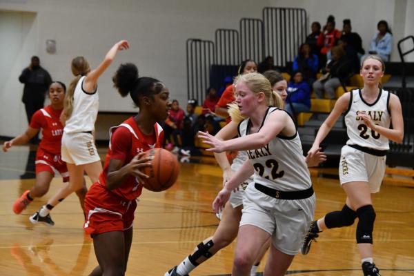 Sealy’s Elizabeth Reichardt applies defense to a Brookshire Royal defender during a district game held last week. Sealy will return to district action this Friday against El Campo on the road. PHOTOS BY JIMMY GALVAN