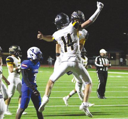 Sealy juniors Haden Wernecke and D’vonne Hmielewski celebrate the second of their two touchdown connections Friday night at Wharton’s Eddie Joseph Memorial Stadium. COLE McNANNA