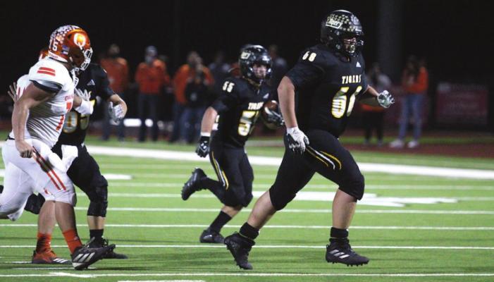 Tiger senior Kade Killough (68) looks to make a block for lineman Jackson Osborne (55) on a trick play in Sealy’s bi-district playoff game against Orangefield at Huffman’s Falcon Stadium. Killough represented the Tigers on the first-team all-state awarded by the Padilla Poll. (Cole McNanna/Sealy News)