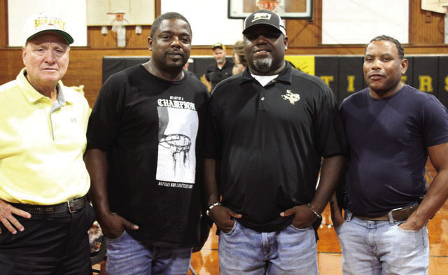 These former Sealy Tiger football team members who played on the 1995 state were gathered for the 30-year reunion last Friday before the Sealy-Bellville football game. From left: Coach Billy Norris outside linebackers coach; Forrest Wagner, all-state safety; Bobby Wigfall, defensive back; and Brian Johnson running back.