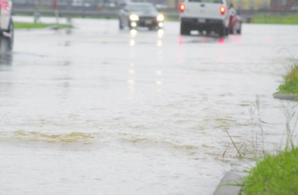Heavy rains June 3 caused flooded roadways all over town, including Schmidt Road in Sealy. COLE McNANNA
