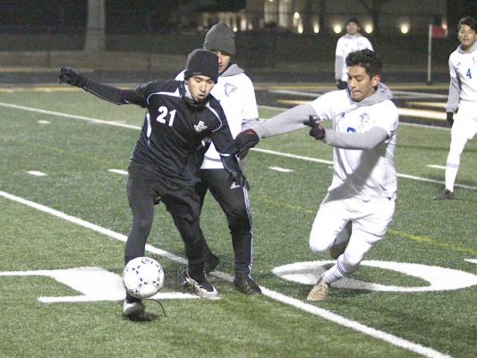 Sealy sophomore Amador Lopez battles a pair of Royal defenders during the second half of the District 20-4A contest between the Tigers and Falcons on Mark A. Chapman Field at T.J. Mills Stadium in Sealy last Friday night. Cole McNanna