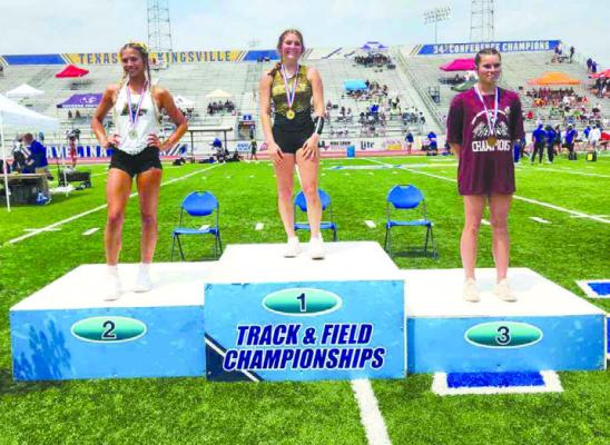 Emma Statham sits on top of the platform at the Regional meet winning the pole vault event. COURTESY PHOTO