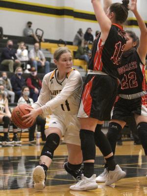 Sealy junior Evelyn Harrington drives and looks to make a pass in a home non-district game against the Gonzales Apaches on Dec. 7. Harrington led the Lady Tigers with 16 points in their win last Friday on the road in East Bernard. Cole McNanna