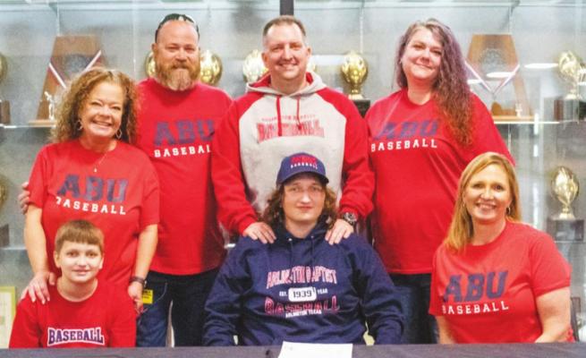 Sealy senior Luke Kovar was joined by family in signing with Arlington Baptist to play baseball during a March 2 ceremony in the high school’s gym foyer. COLE McNANNA