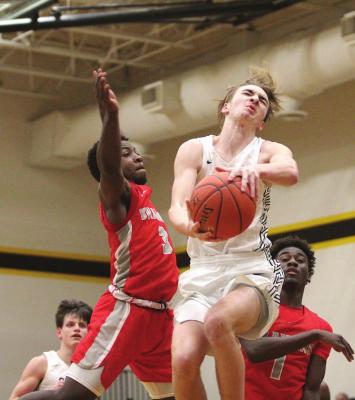 Sealy senior Jacob Gajewski goes up to the basket in the district finale against Bellville at home Feb. 12. Gajewski scored 12 points in the Tigers’ bi-district loss to Yates last Saturday. COLE McNANNA