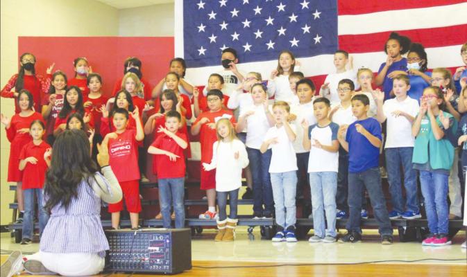 Music Director Dalia Lee led the Brazos Elementary fourth graders in their annual Veterans Day Program in the school’s cafeteria last Thursday. PHOTOS BY HANS LAMMEMAN