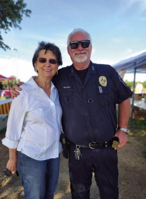 Sealy Police Chief Jay Reeves takes a photo with Sealy Mayor Carolyn Bilski during Sealy PD KidsFish on May 3.