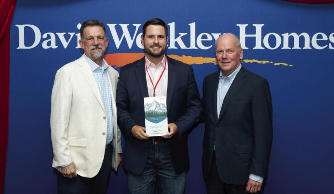 COURTESY PHOTO John Schiegg, Vice President of Weekley Homes, Jacob Emery of Acme Brick Company and John Johnson of Weekley Homes with Acme Brick’s Partner of Choice award.
