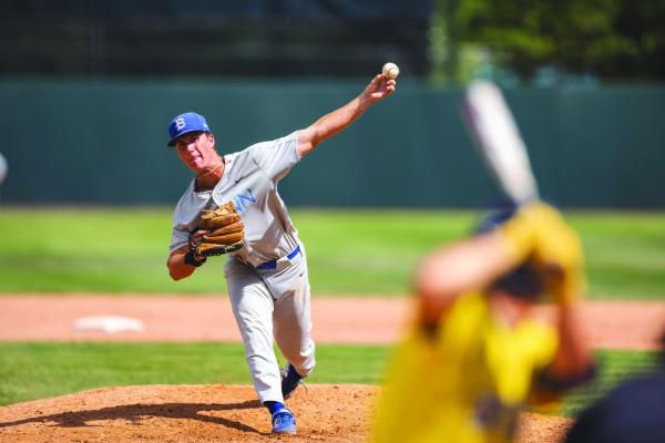 Blinn’s Ben Polleschultz fires a pitch home during the contest with Johnson County.
