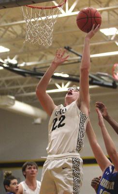 Sealy freshman Lane Miller puts back a bucket during the Tigers’ 109-14 win over Brazosport Christian last Saturday at home. Cole McNanna