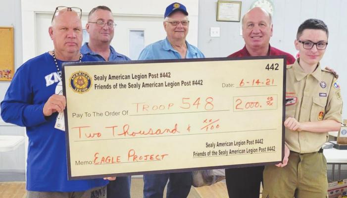 The Friends of the Sealy American Legion Post 442 – represented by Chuck Tomlinson, David Littmann, Pete Berckenhoff and Larry Kuciemba – presented a donation to Sealy Boy Scout Troop 548 Tyler Burgess in recognition of his achievement of Eagle Scout June 14. CONTRIBUTED PHOTO